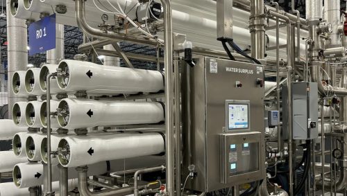 High-recovery reverse osmosis system with membrane housings and control panel