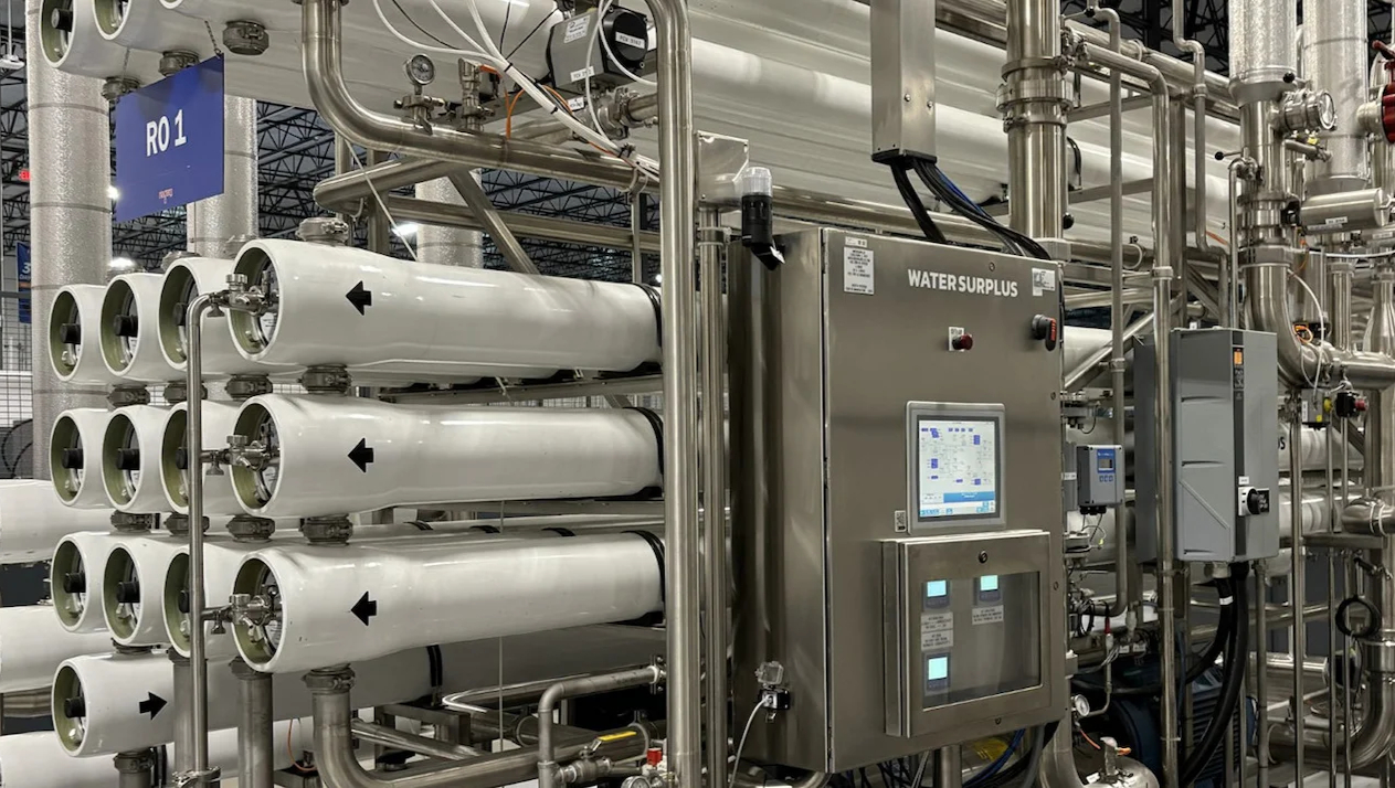 High-recovery reverse osmosis system with membrane housings and control panel